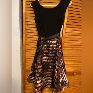 Black and floral tea-length dress with bow detailing.